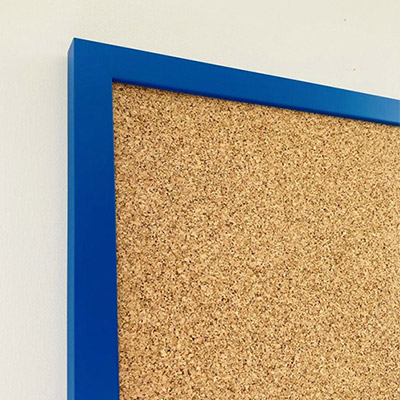 Blue framed cork pin board