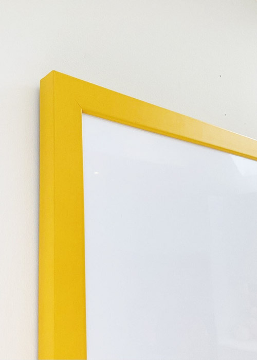 Yellow framed magnetic white board