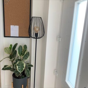 Black notice board in hallway