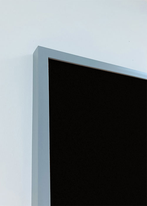 Light grey framed magnetic black chalk board